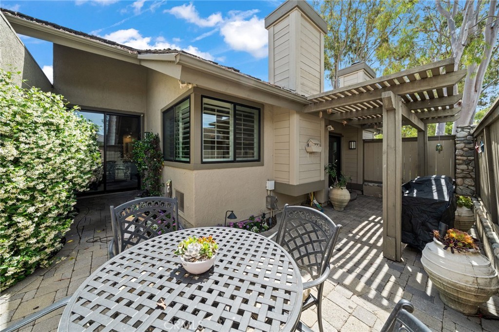 49 Pinewood, Unit 25 Irvine, CA 92604 - Photo 33 of 42 a front view of a house with outdoor seating
