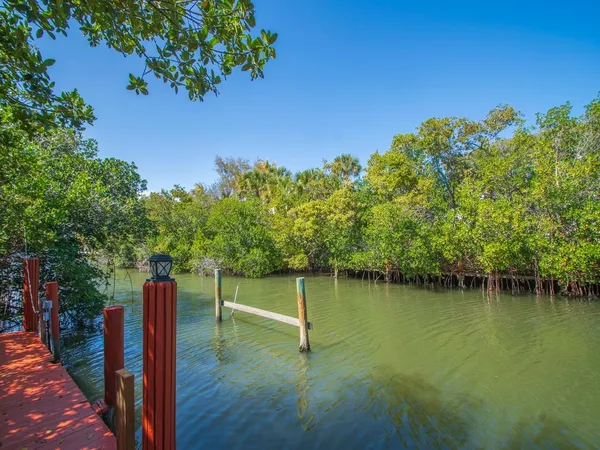 a view of a lake with a yard