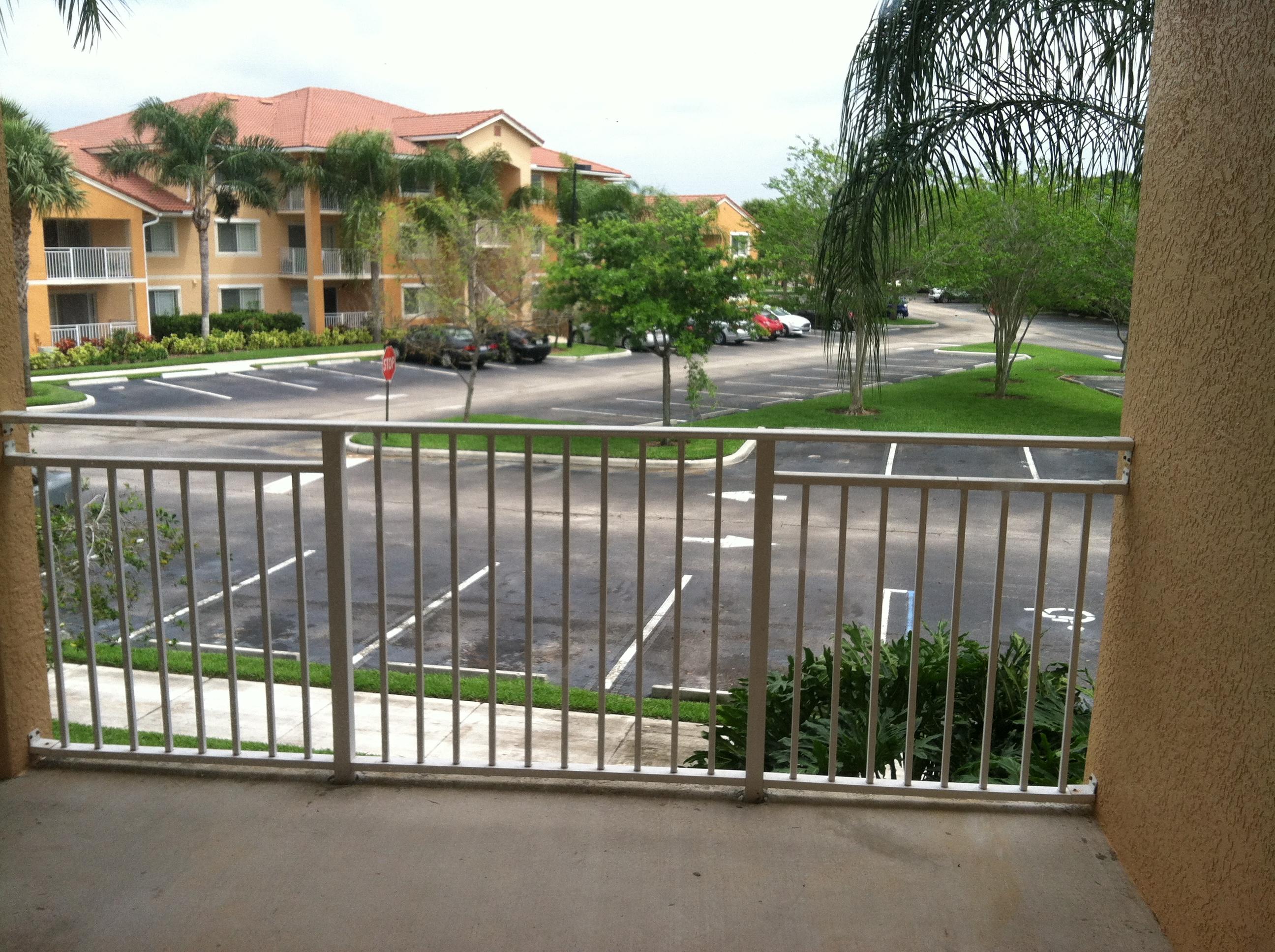 171 Southwest Palm Drive, Unit 205 Port St. Lucie, FL 34986 - Photo 4 of 8 a view of a street from a balcony