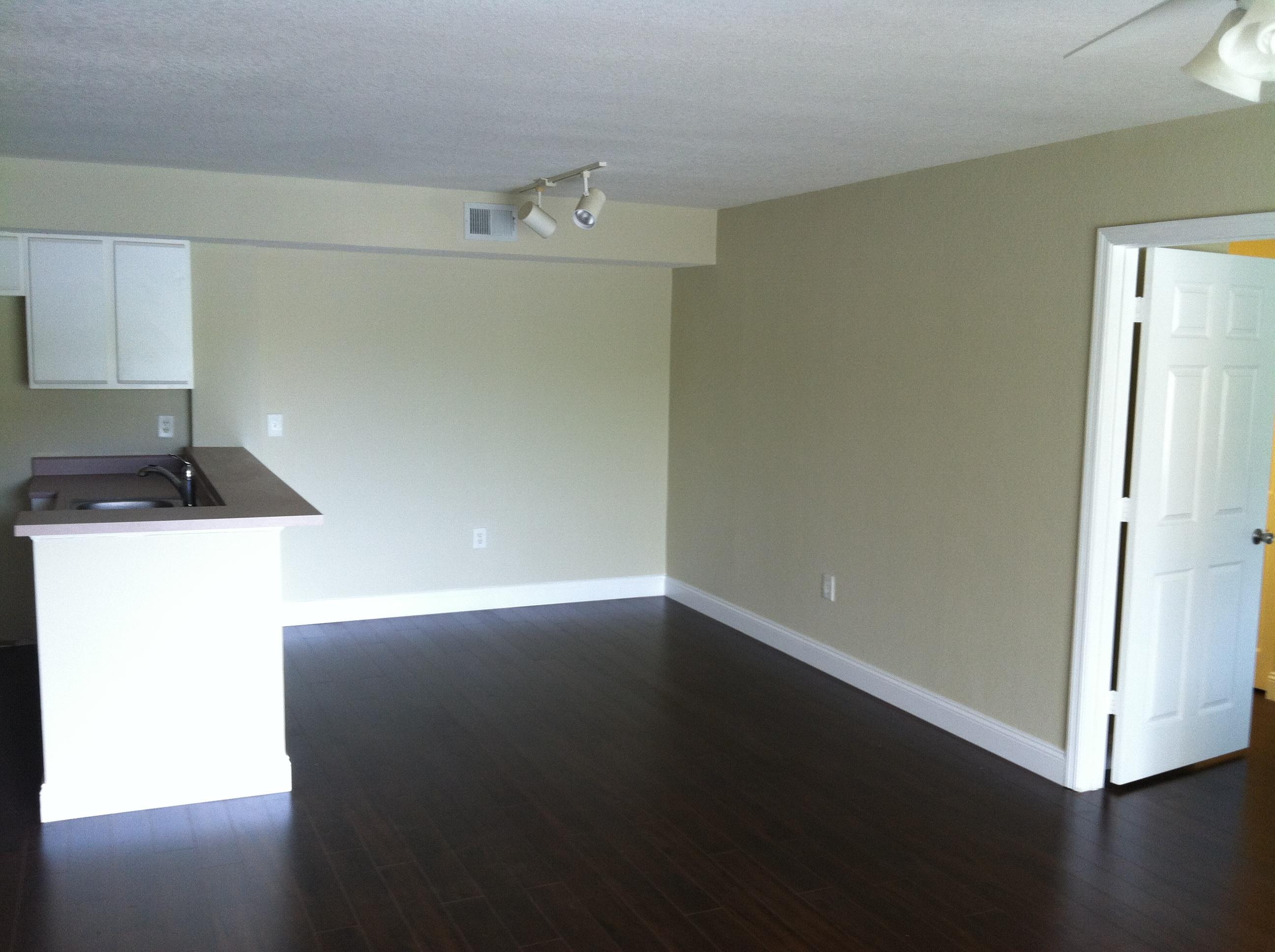 171 Southwest Palm Drive, Unit 205 Port St. Lucie, FL 34986 - Photo 5 of 8 a view of an empty room and wooden floor
