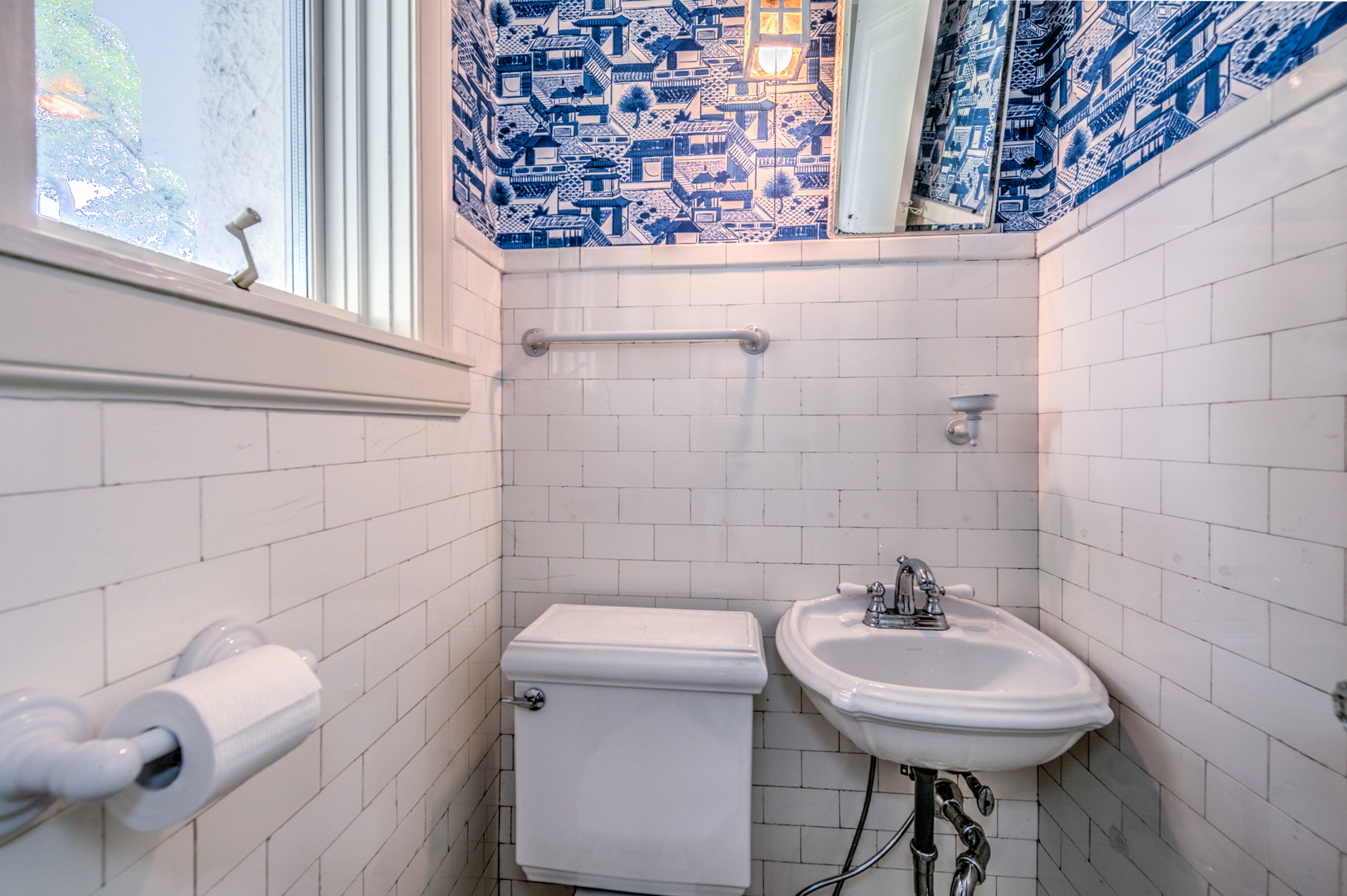 141 Sheridan Road Winnetka, IL 60093 - Photo 15 of 58 a bathroom with a sink a toilet and mirror