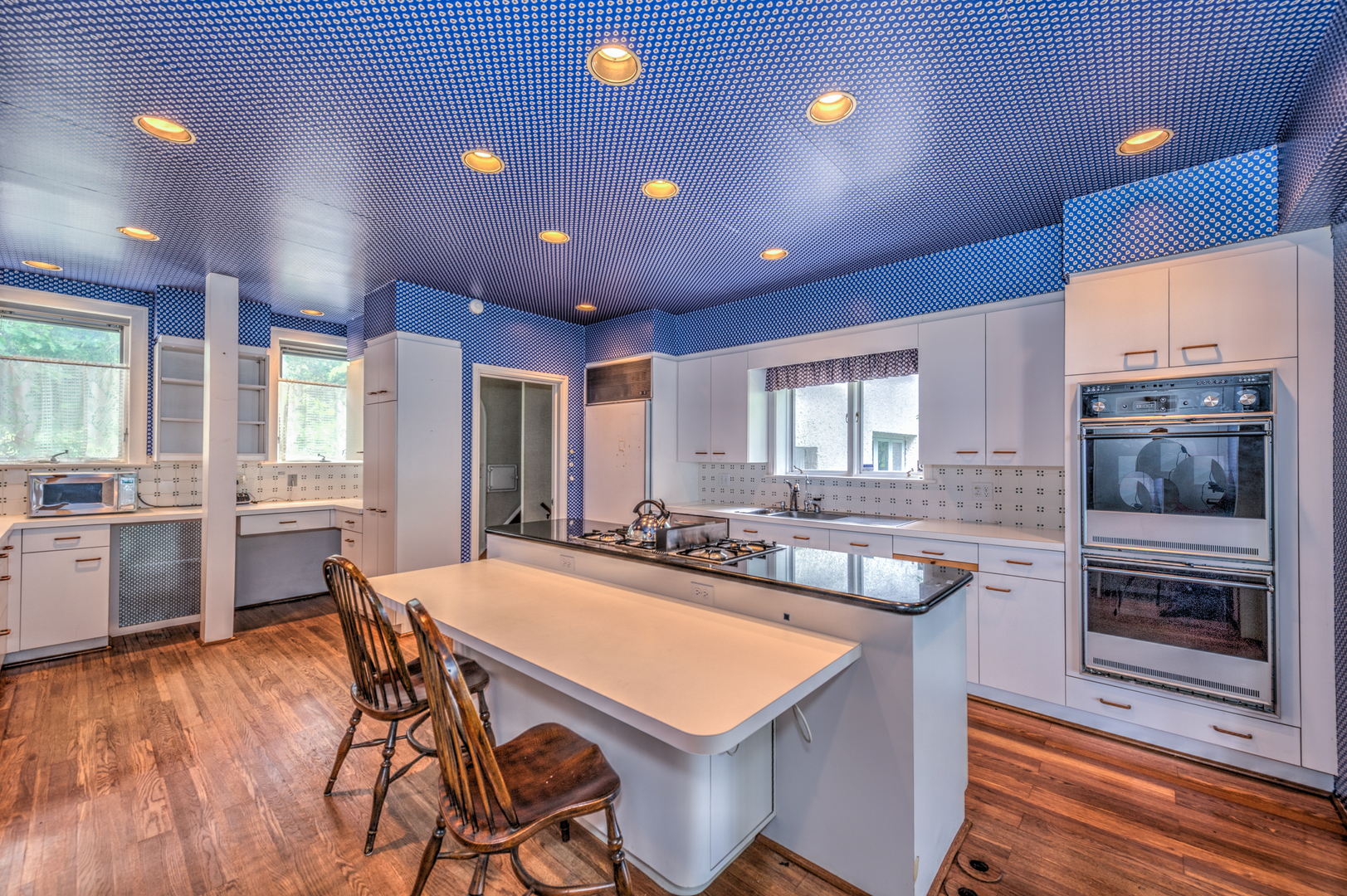 141 Sheridan Road Winnetka, IL 60093 - Photo 21 of 58 a kitchen with kitchen island a large counter top space and stainless steel appliances