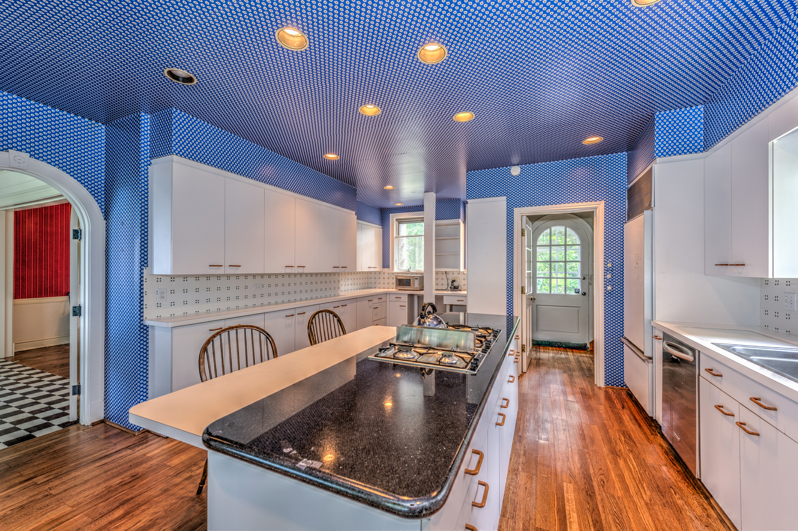 141 Sheridan Road Winnetka, IL 60093 - Photo 22 of 58 a kitchen with stainless steel appliances granite countertop a sink a stove and a wooden floors