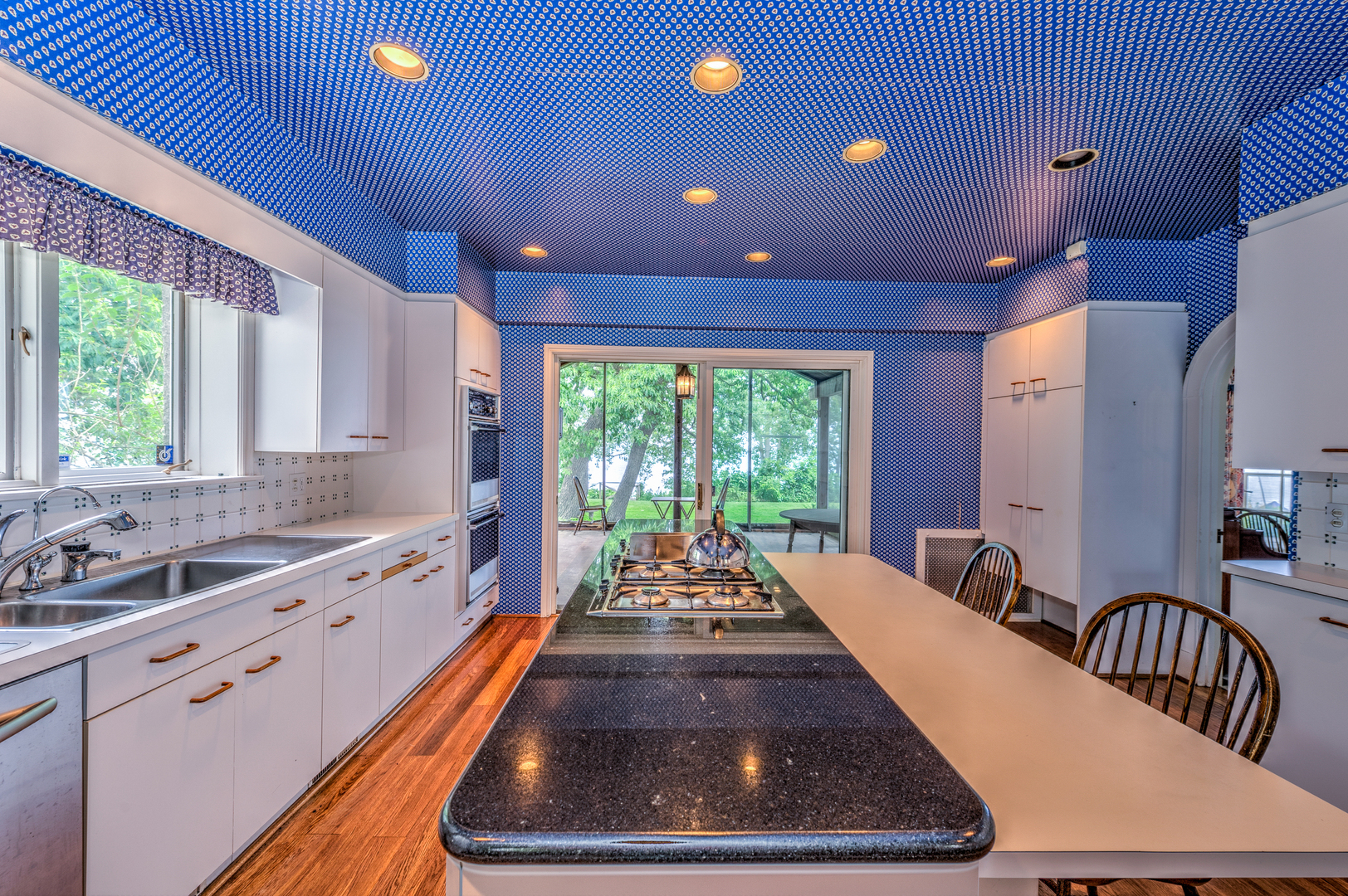 141 Sheridan Road Winnetka, IL 60093 - Photo 25 of 58 a large kitchen with kitchen island a large window