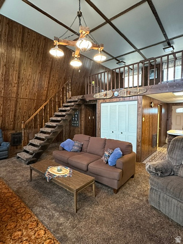 1085 West Elk Road Helper, UT 84526 - Photo 8 of 40 Vaulted ceiling with exposed wood beams and central chandelier
