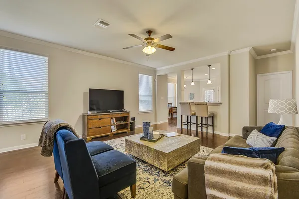 a living room with furniture and a flat screen tv