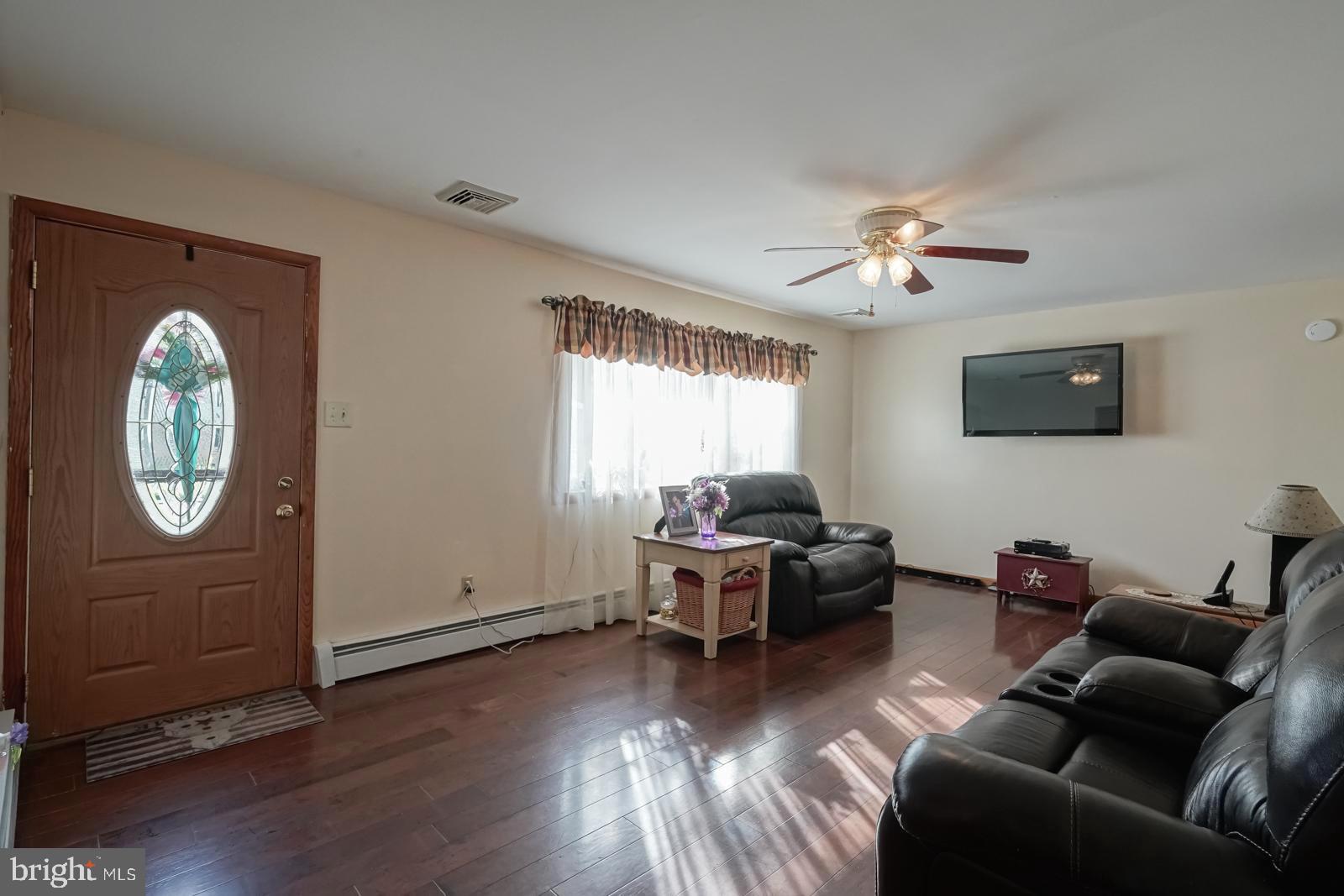 82 Georgia Road Pennsville, NJ 08070 - Photo 6 of 42 Gleaming Hardwood Floors in Living Room
