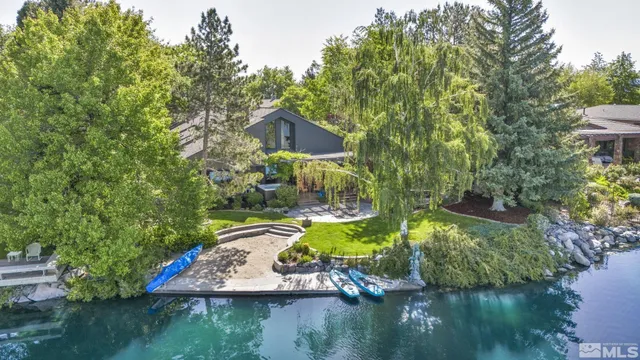 a view of a house with pool and a yard