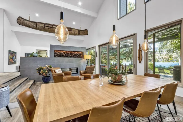a view of a dining room with furniture wooden floor and chandelier