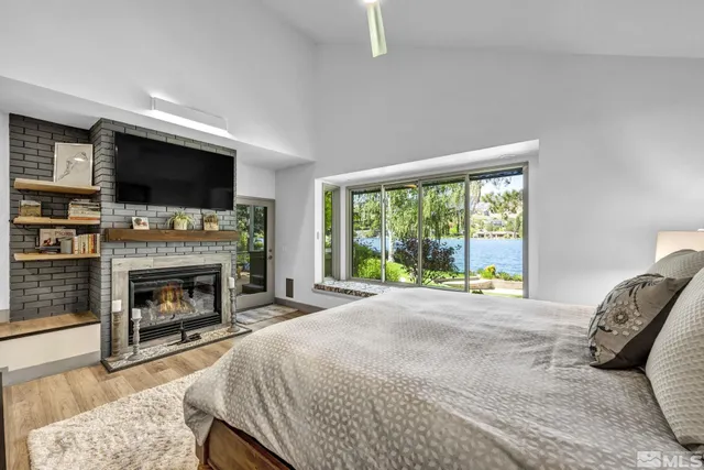 a bed room with a bed and a television