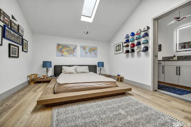 a bedroom with a bed and a desk