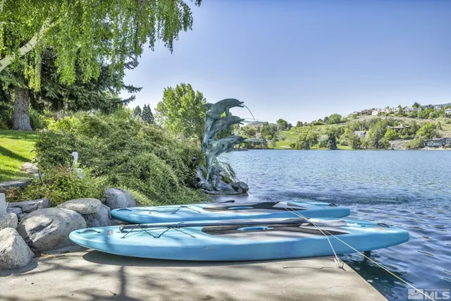 a view of a yard with table and chairs