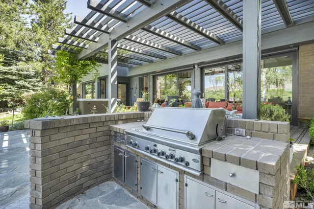 a view of a couches and table in the patio