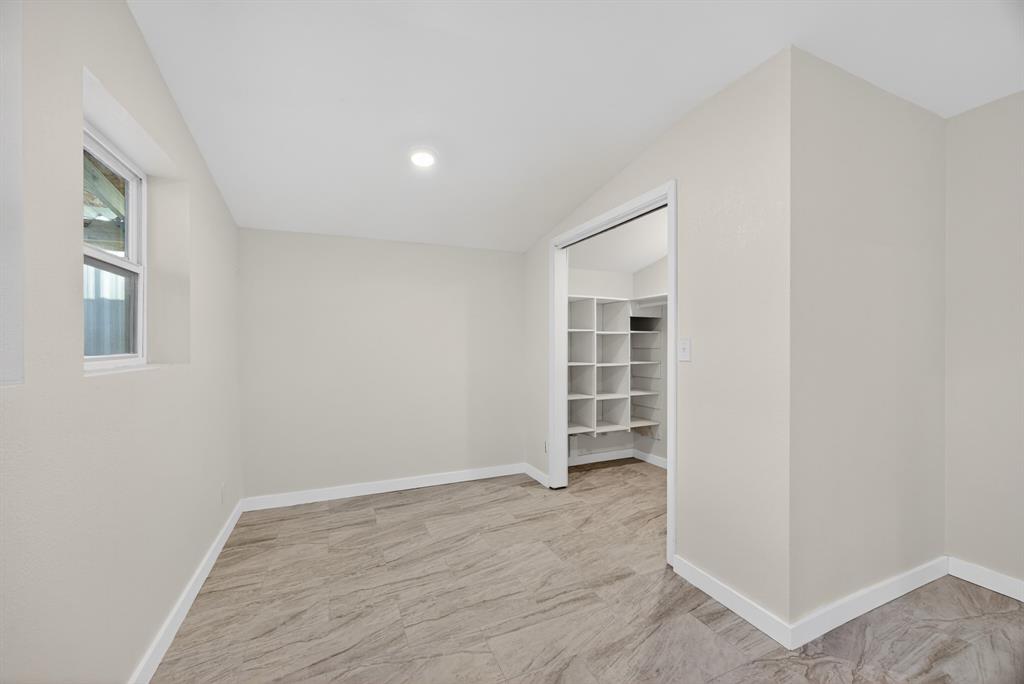 6775 Silver Creek Azle Road Azle, TX 76020 - Photo 26 of 40 Spare room with lofted ceiling and baseboards