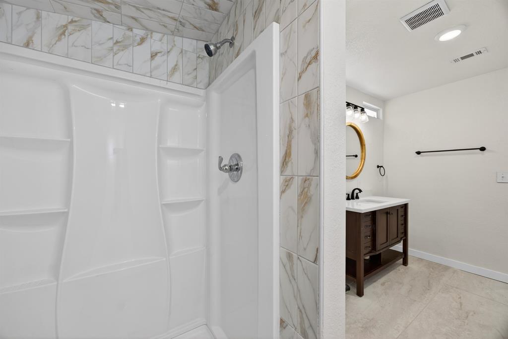 6775 Silver Creek Azle Road Azle, TX 76020 - Photo 28 of 40 Bathroom featuring vanity and a shower stall
