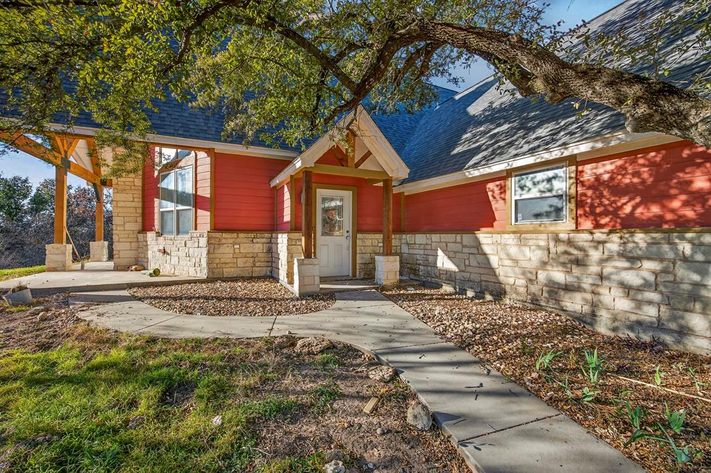 6775 Silver Creek Azle Road Azle, TX 76020 - Photo 4 of 40 View of front facade featuring stone siding and roof with shingles