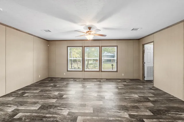 a kitchen with kitchen island a counter top space appliances and a sink