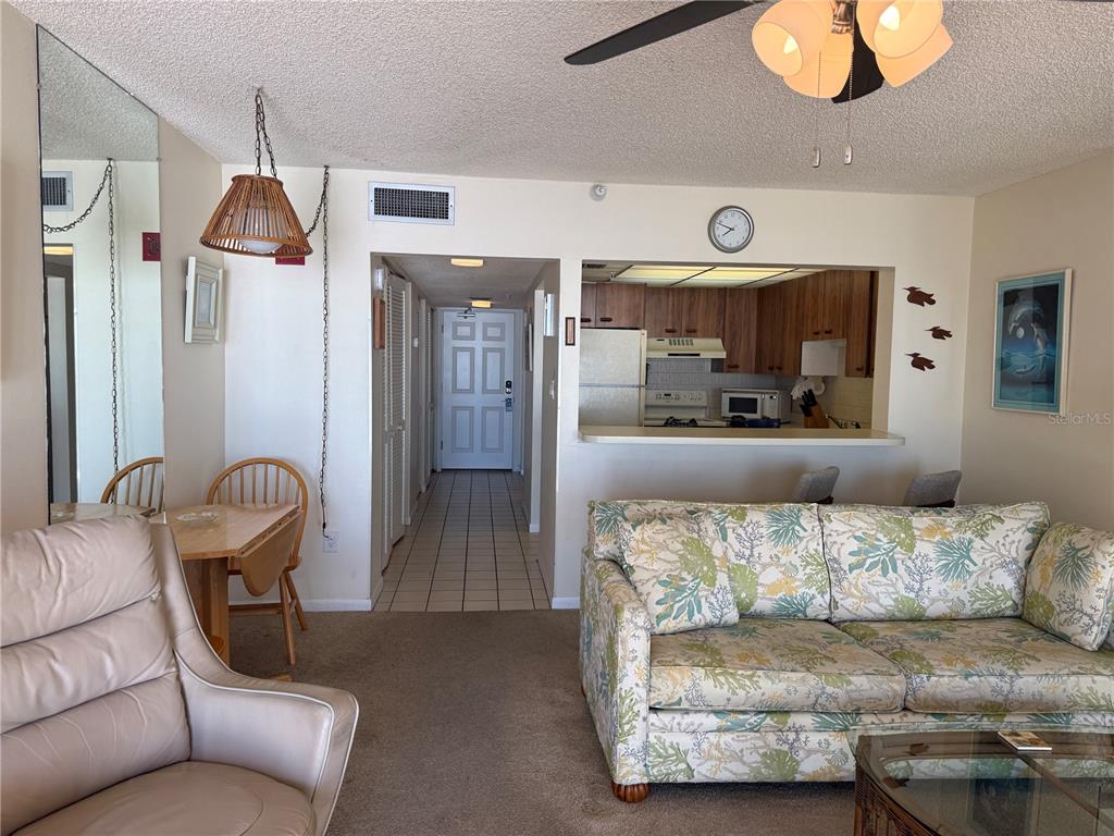 14950 Gulf Boulevard, Unit 805 Madeira Beach, FL 33708 - Photo 18 of 35 a living room with a couch and a coffee table