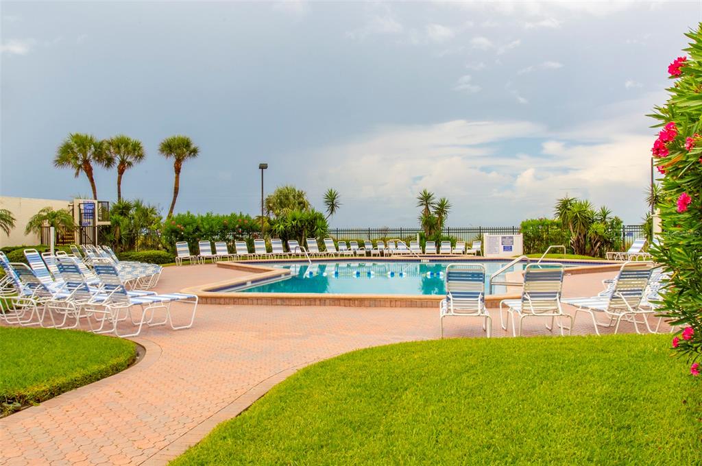 14950 Gulf Boulevard, Unit 805 Madeira Beach, FL 33708 - Photo 6 of 35 a view of a swimming pool with outdoor seating space