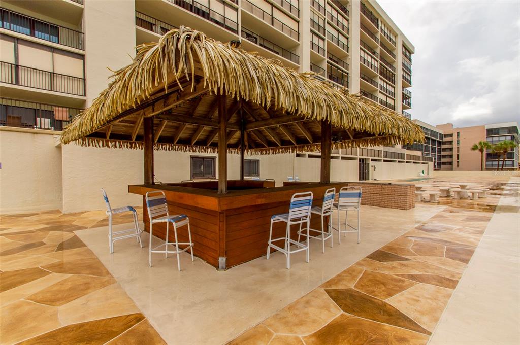 14950 Gulf Boulevard, Unit 805 Madeira Beach, FL 33708 - Photo 8 of 35 a patio with a table and chairs
