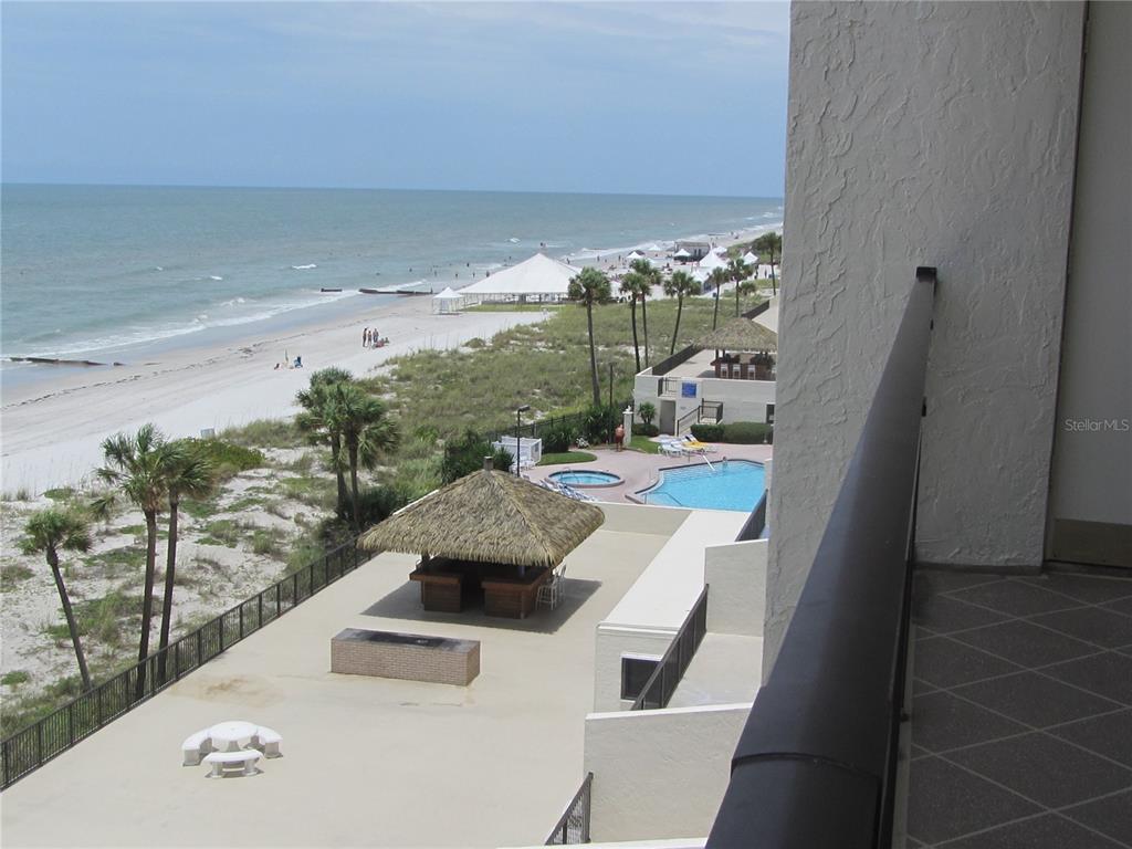 14950 Gulf Boulevard, Unit 805 Madeira Beach, FL 33708 - Photo 10 of 35 a living room with furniture and a large window