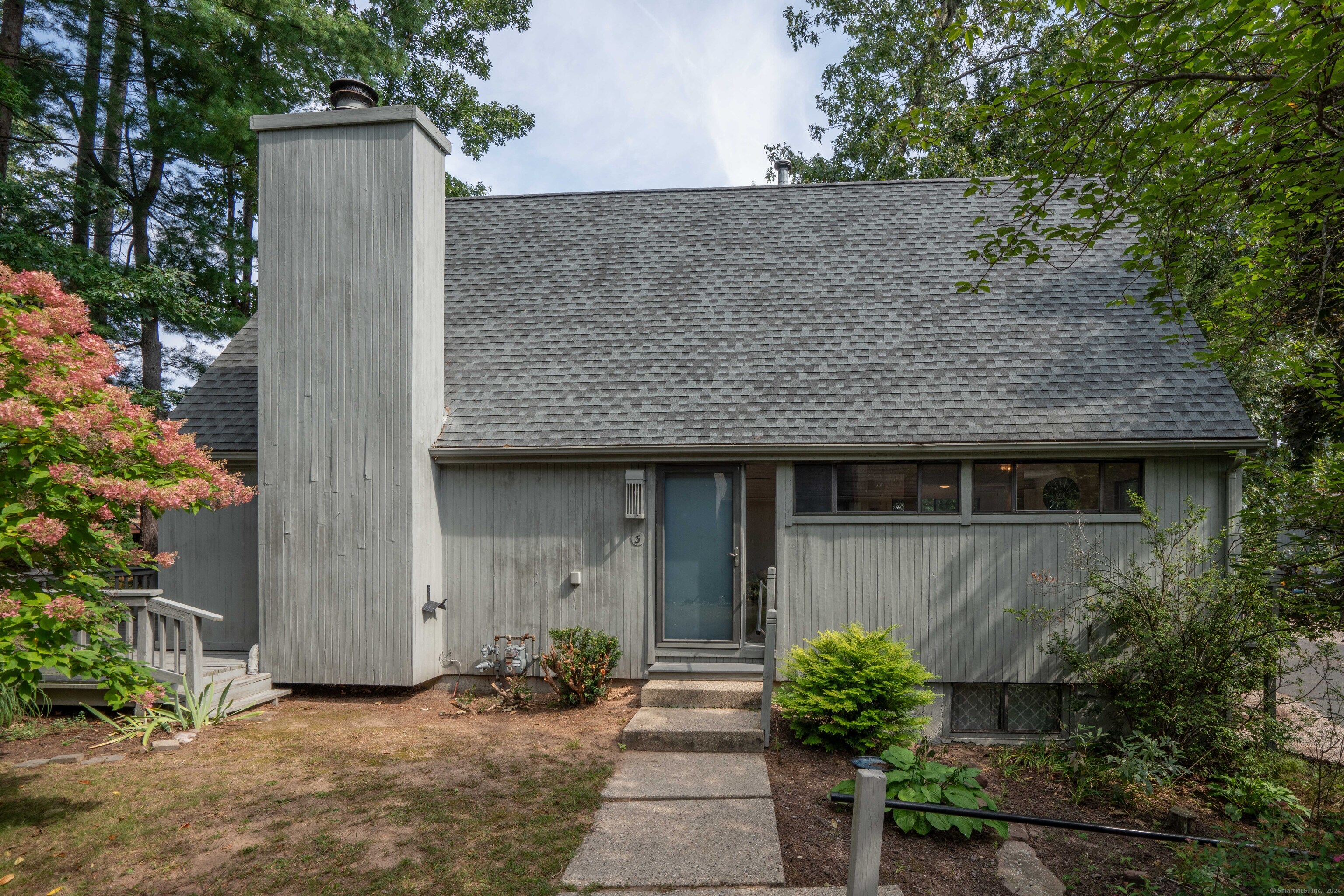 3 Laurel Lane, Unit 3 Avon, CT 06001 - Photo 1 of 1 front view of a house with potted plants