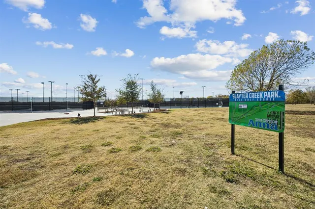 a swimming pool with outdoor seating and yard