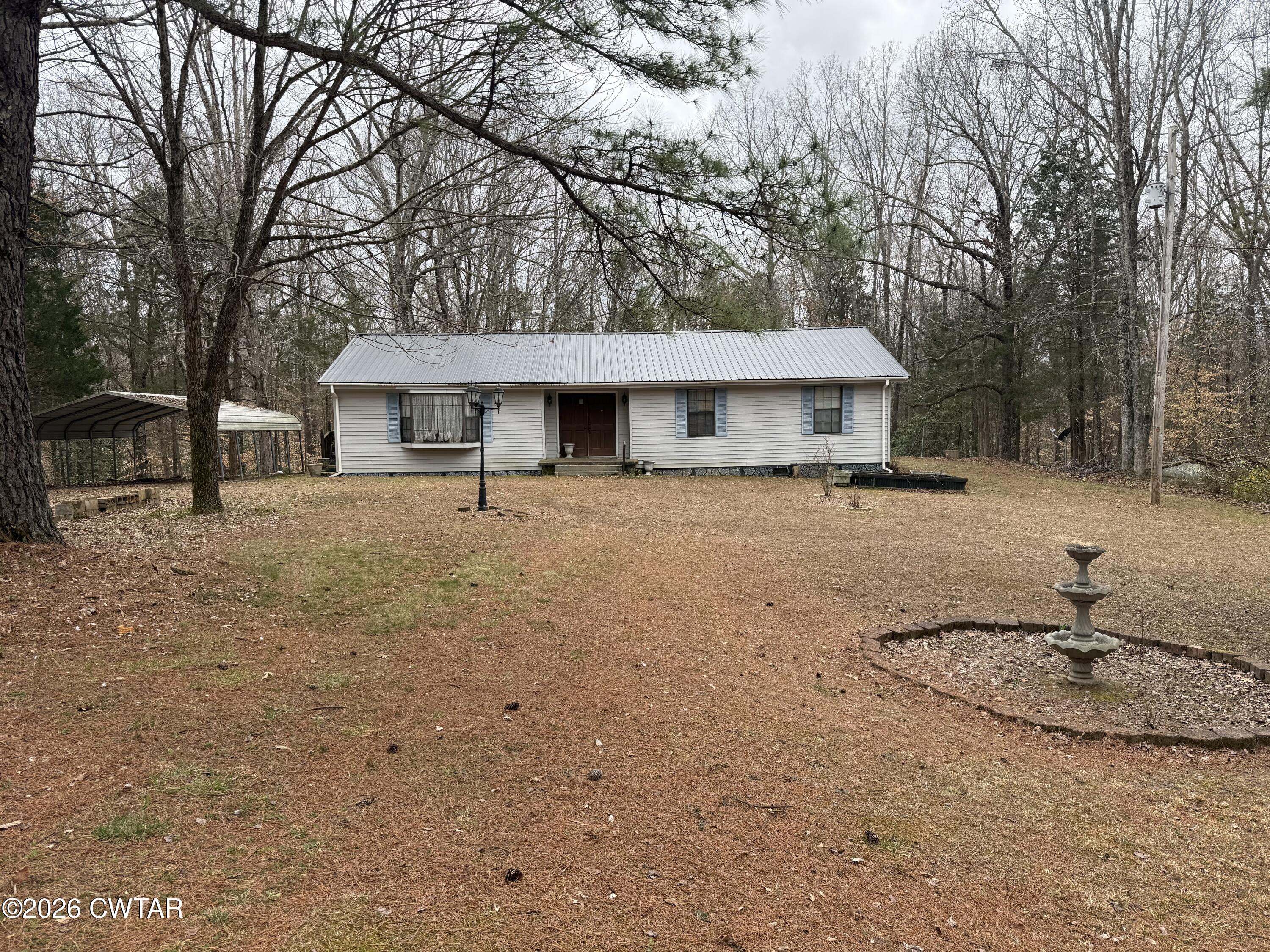 875 New Friendship Road Buena Vista, TN 38318 - Photo 1 of 13 a view of a house with a snow in the yard