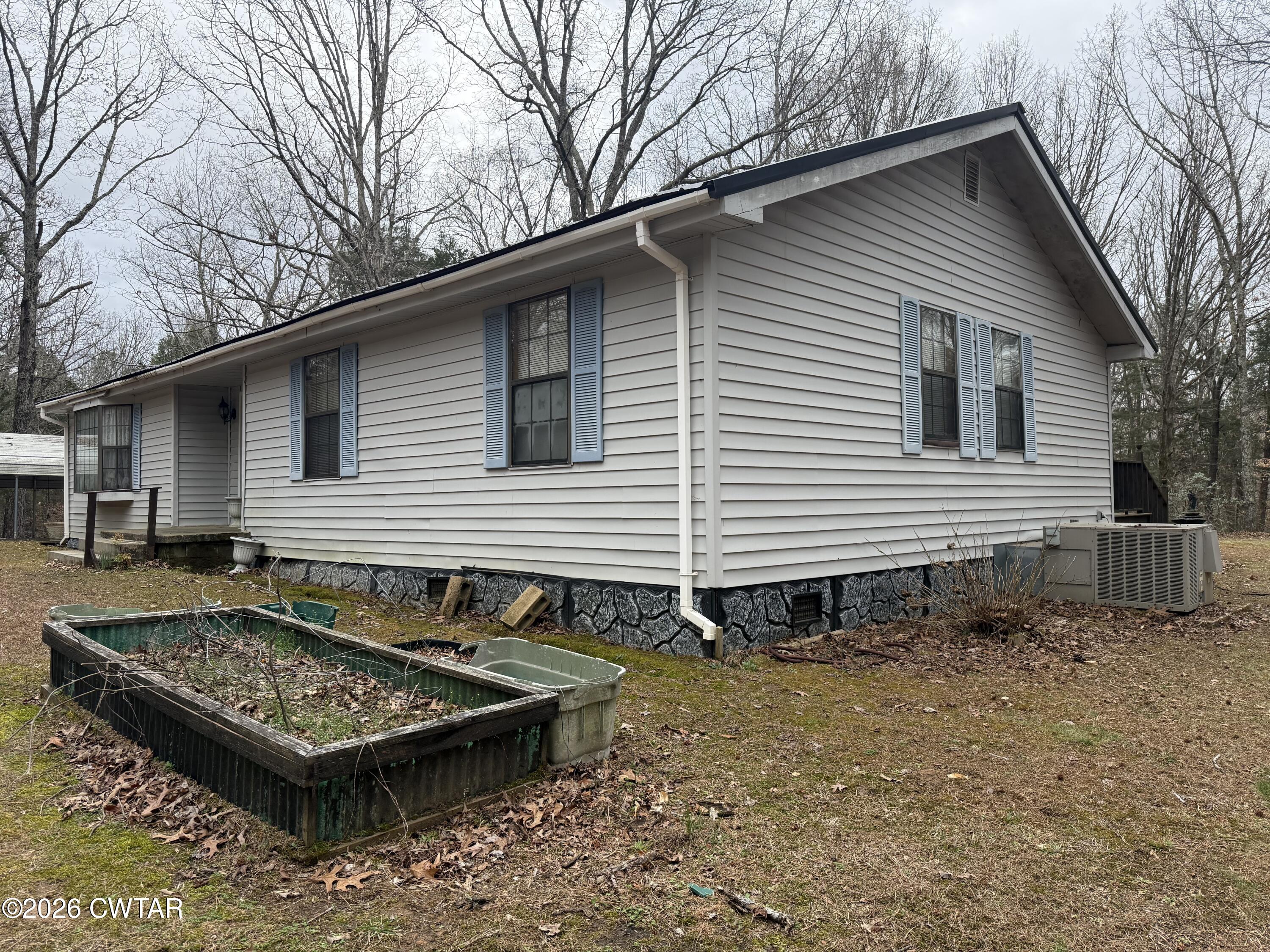 875 New Friendship Road Buena Vista, TN 38318 - Photo 2 of 13 a view of a small house with a yard