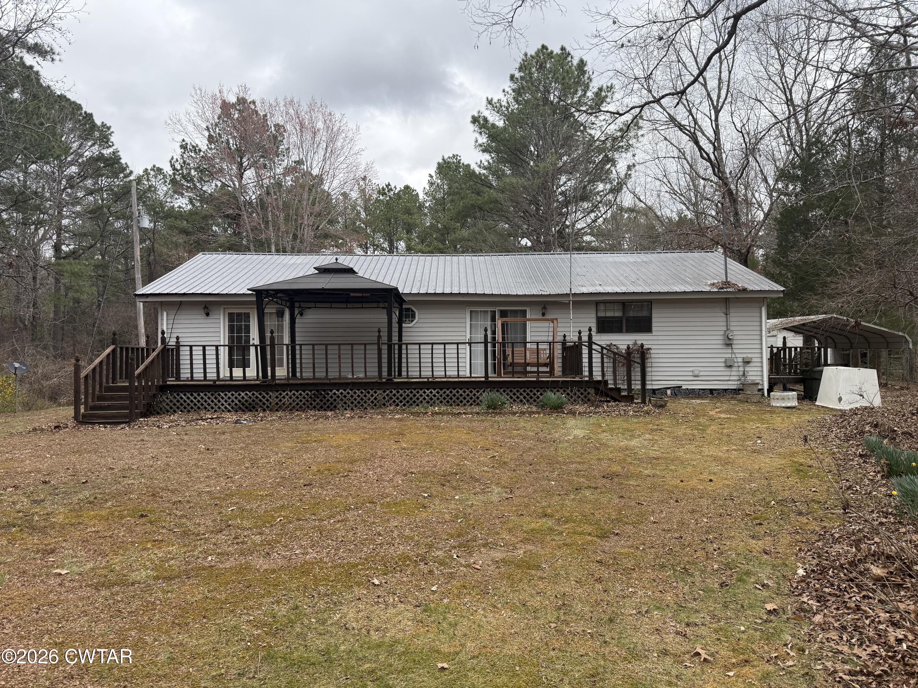 875 New Friendship Road Buena Vista, TN 38318 - Photo 3 of 13 a front view of a house with a garden