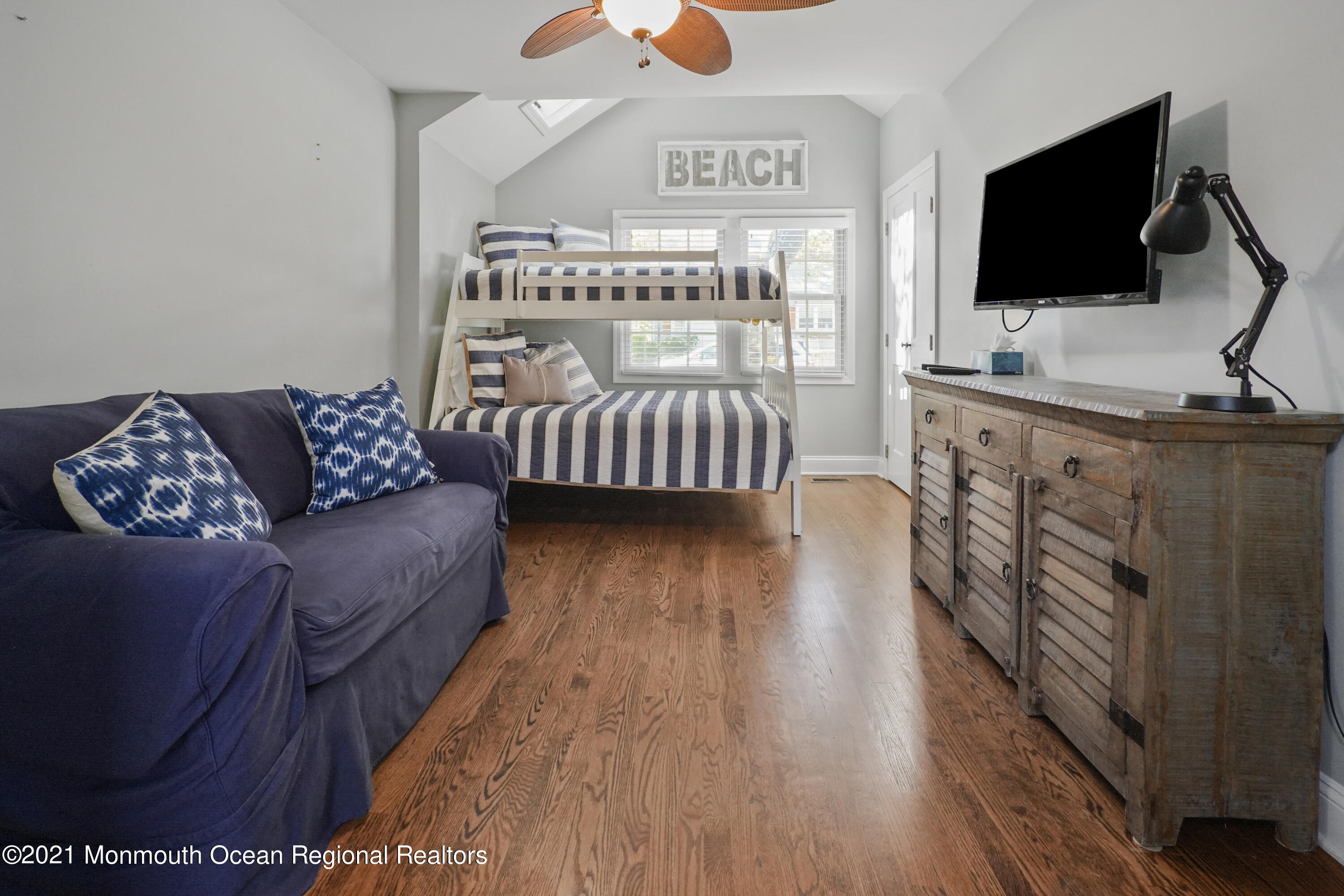 344 Euclid Avenue Manasquan, NJ 08736 - Photo 11 of 24 a bedroom with furniture and a flat screen tv