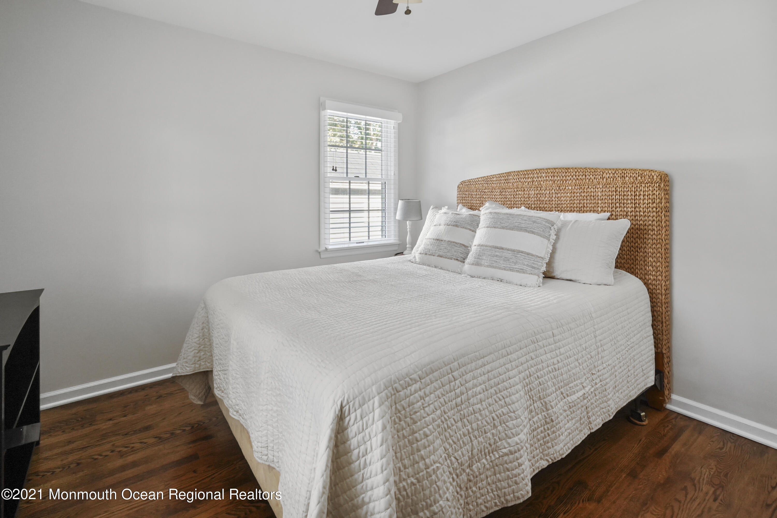 344 Euclid Avenue Manasquan, NJ 08736 - Photo 14 of 24 a large bed sitting in a bedroom next to a window