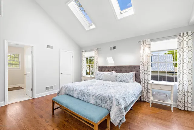 a bedroom with a bed and a table in it