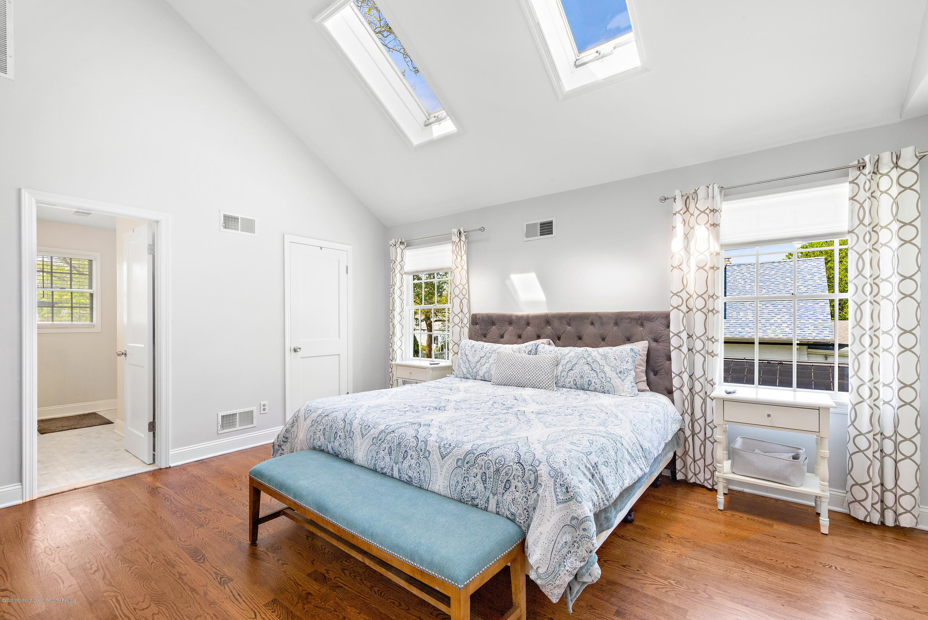 344 Euclid Avenue Manasquan, NJ 08736 - Photo 15 of 24 a bedroom with a bed and a table in it