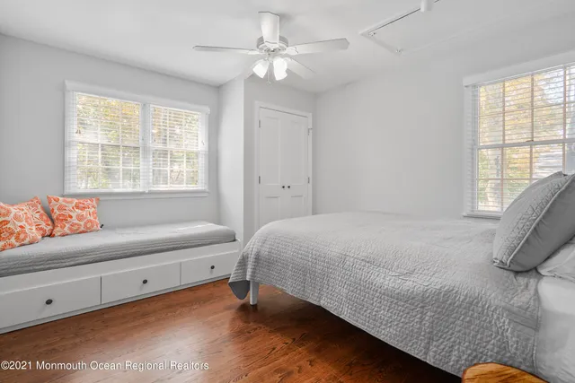 a bedroom with a bed and a couch