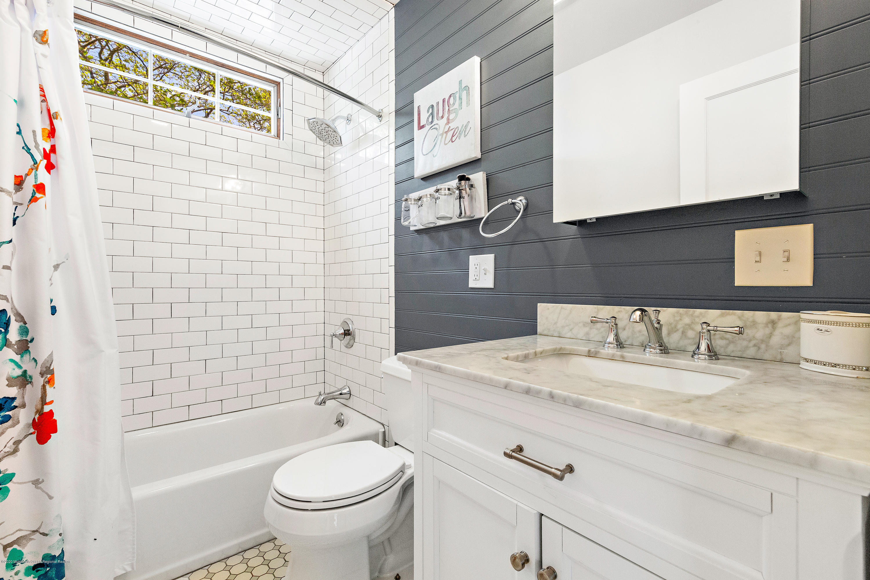 344 Euclid Avenue Manasquan, NJ 08736 - Photo 19 of 24 a bathroom with a granite countertop bathtub sink vanity mirror and toilet