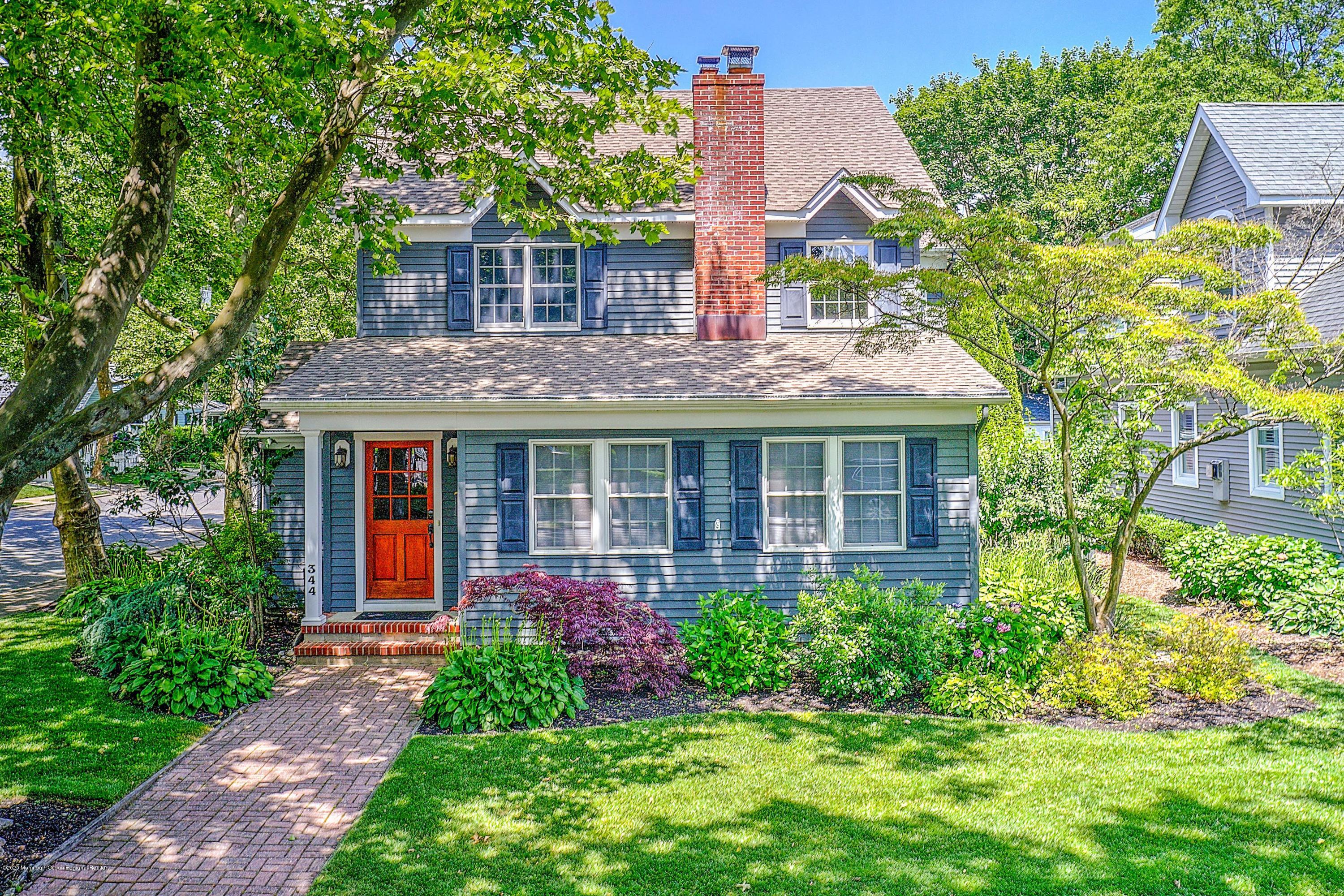 344 Euclid Avenue Manasquan, NJ 08736 - Photo 2 of 24 a front view of a house with garden