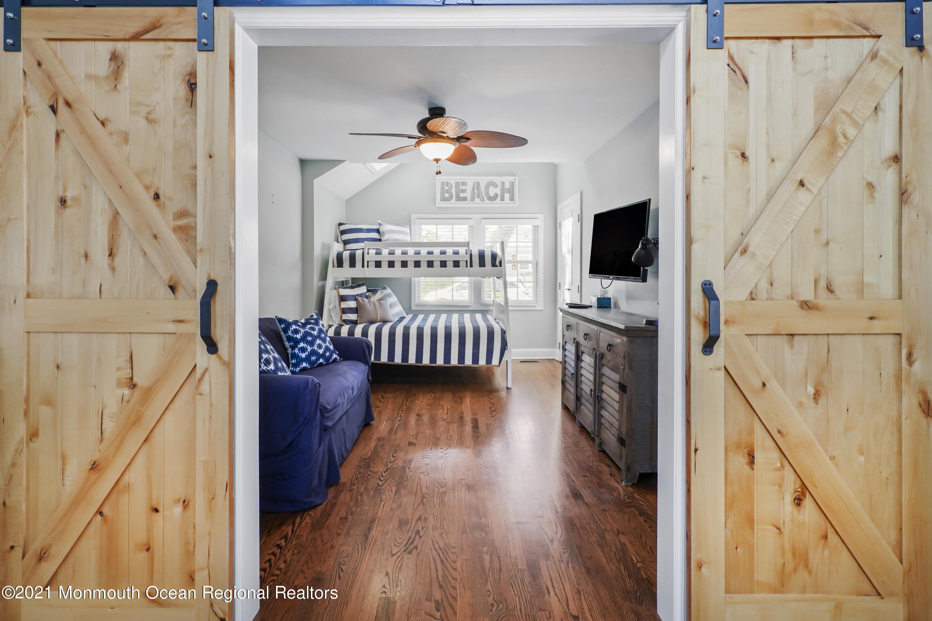 344 Euclid Avenue Manasquan, NJ 08736 - Photo 10 of 24 a living room with furniture and a flat screen tv