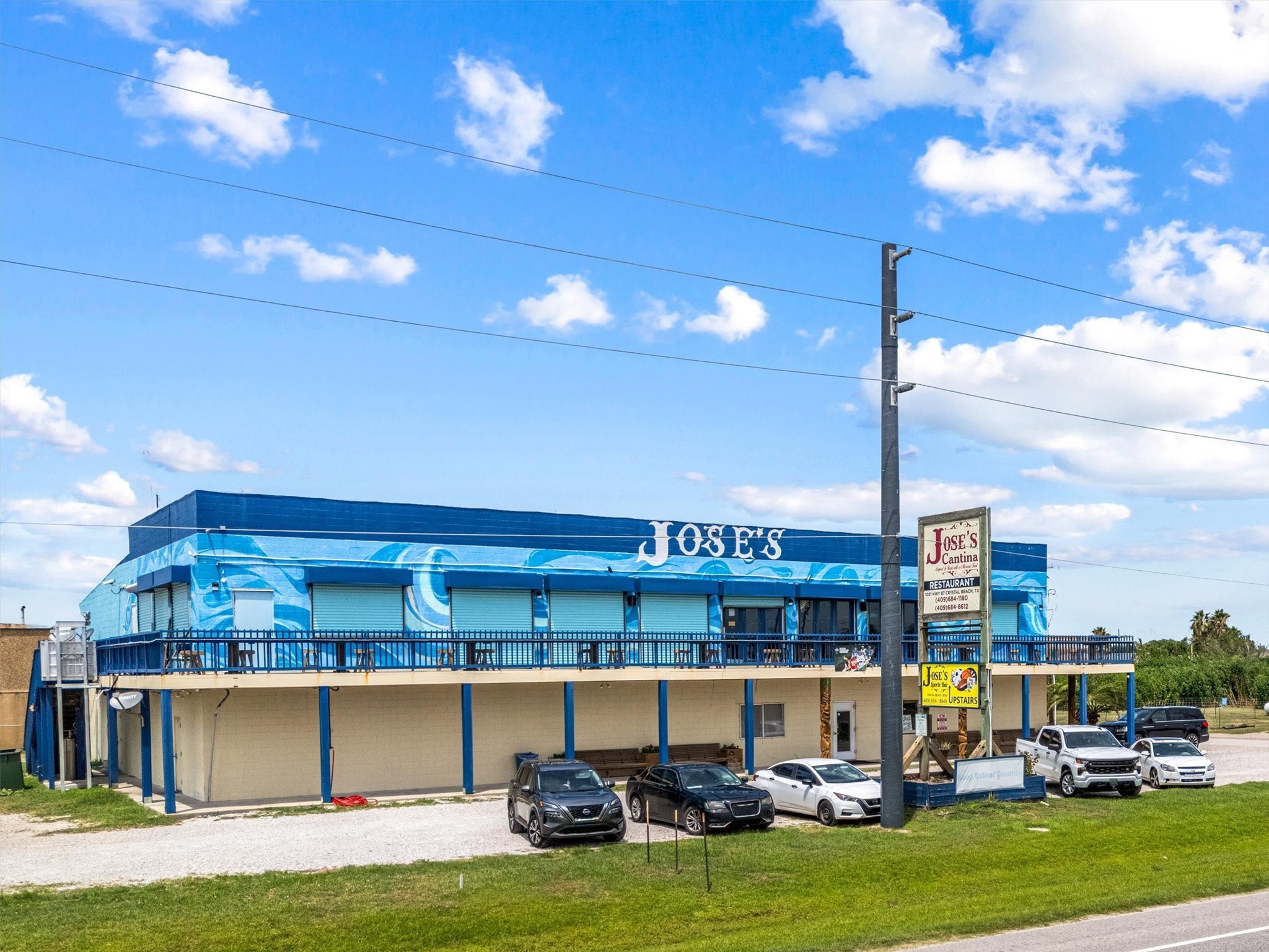 332 Atkinson Street Port Bolivar, TX 77650 - Photo 17 of 30 a view of a patio with a table and chairs