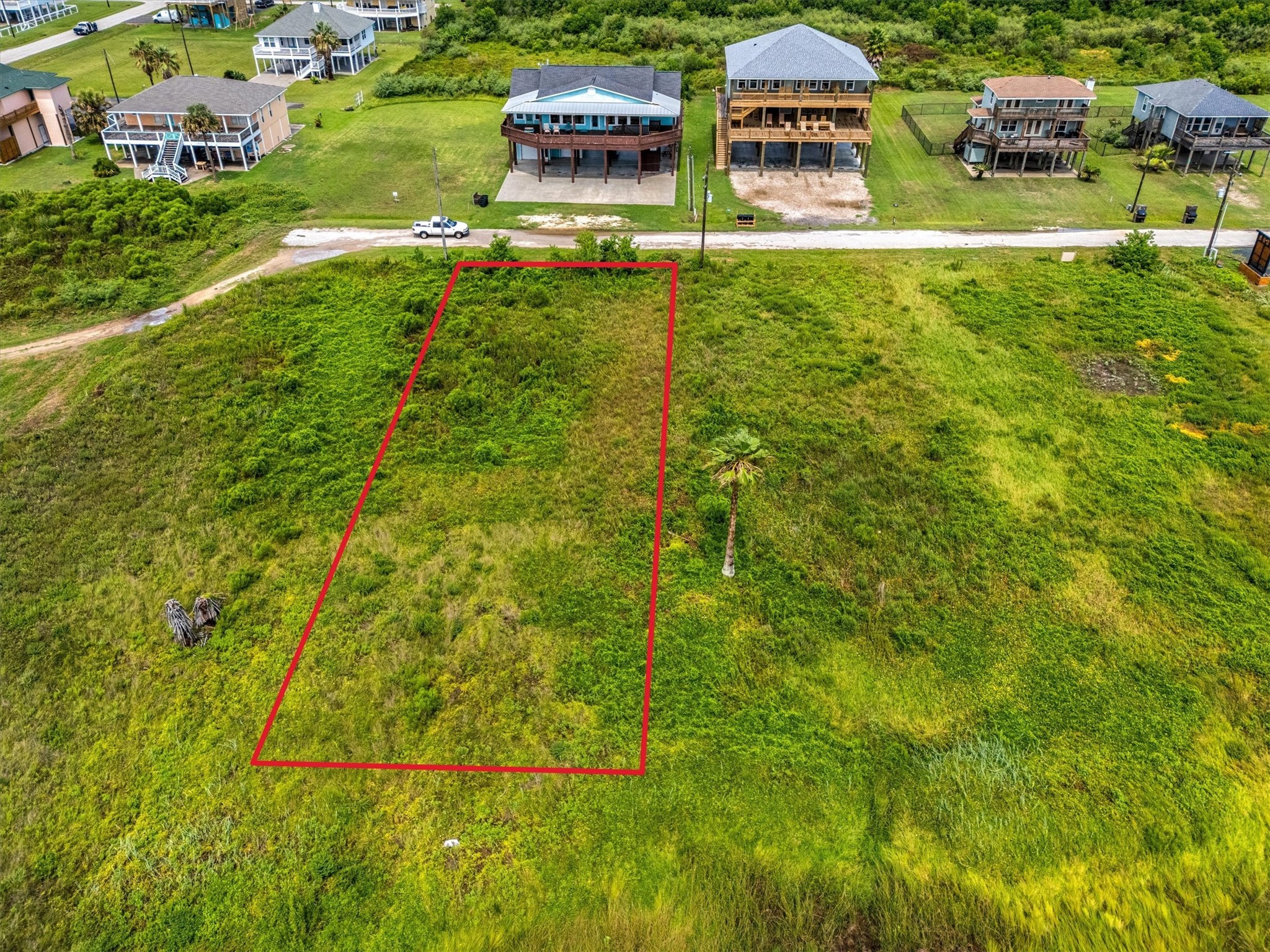 332 Atkinson Street Port Bolivar, TX 77650 - Photo 7 of 30 a view of building with yard