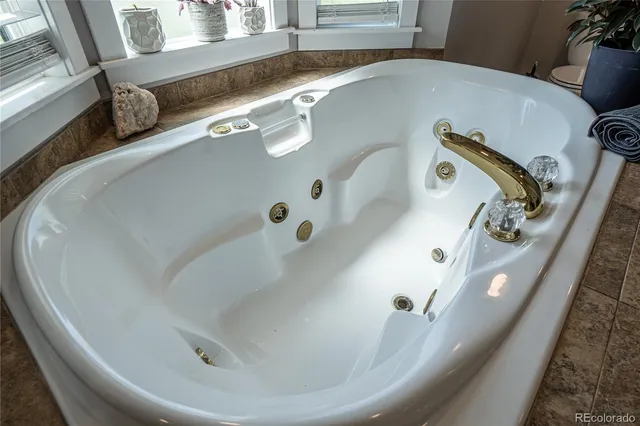 a view of a workspace with furniture and wooden floor