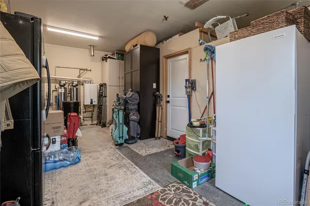 a bathroom with a toilet a sink and a mirror