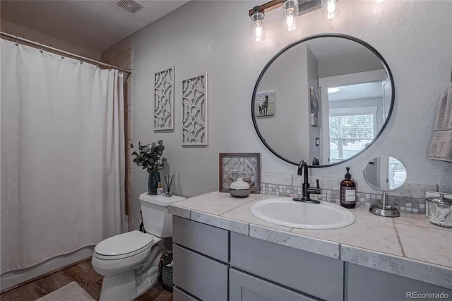 a bathroom with a sink double vanity and a mirror
