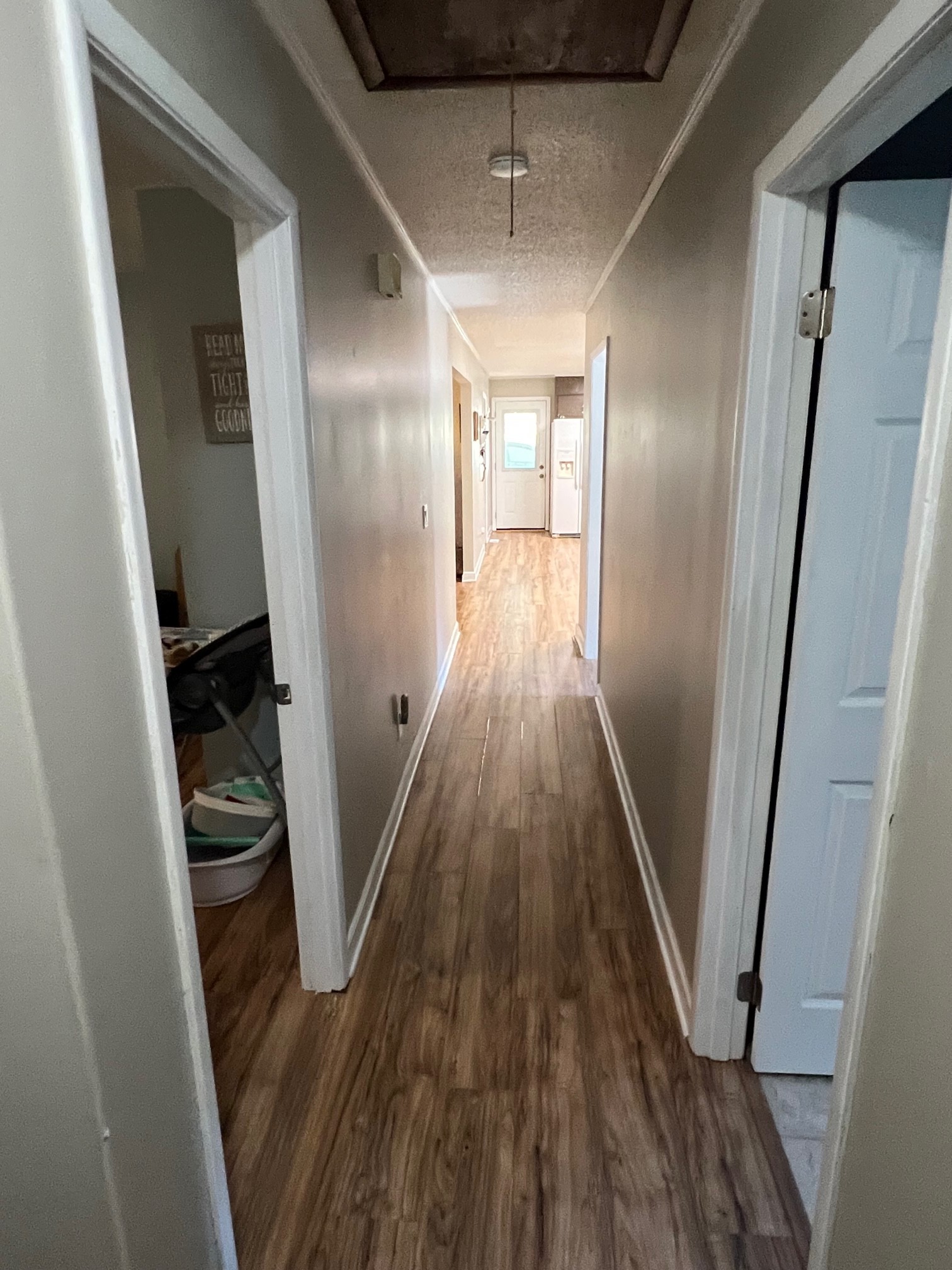 1415 Oak Grove Road Goodspring, TN 38460 - Photo 8 of 24 a view of a hallway with wooden floor and staircase