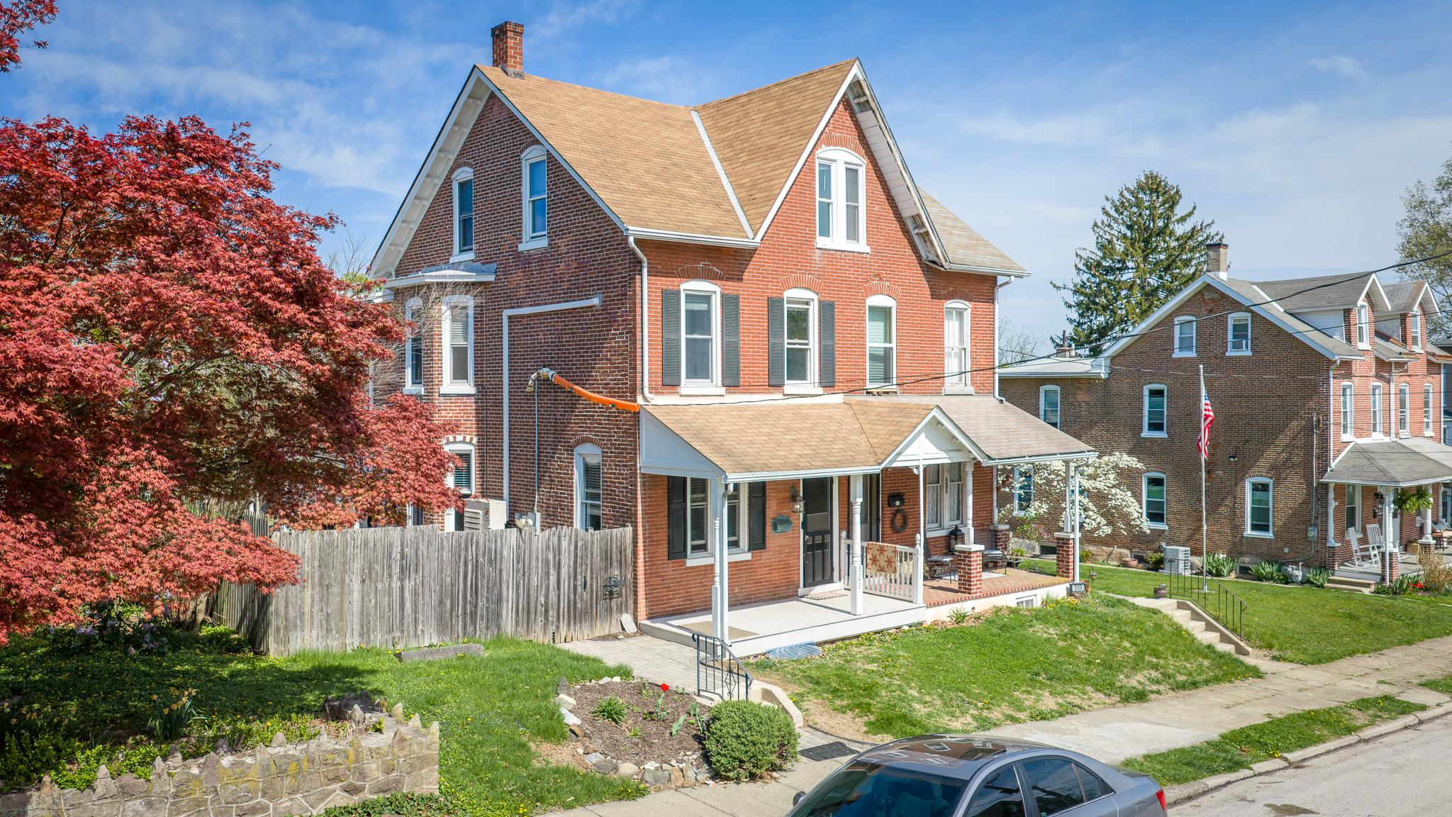 321 Walnut Street Spring City, PA 19475 - Photo 2 of 30 Charming brick home with vibrant garden.