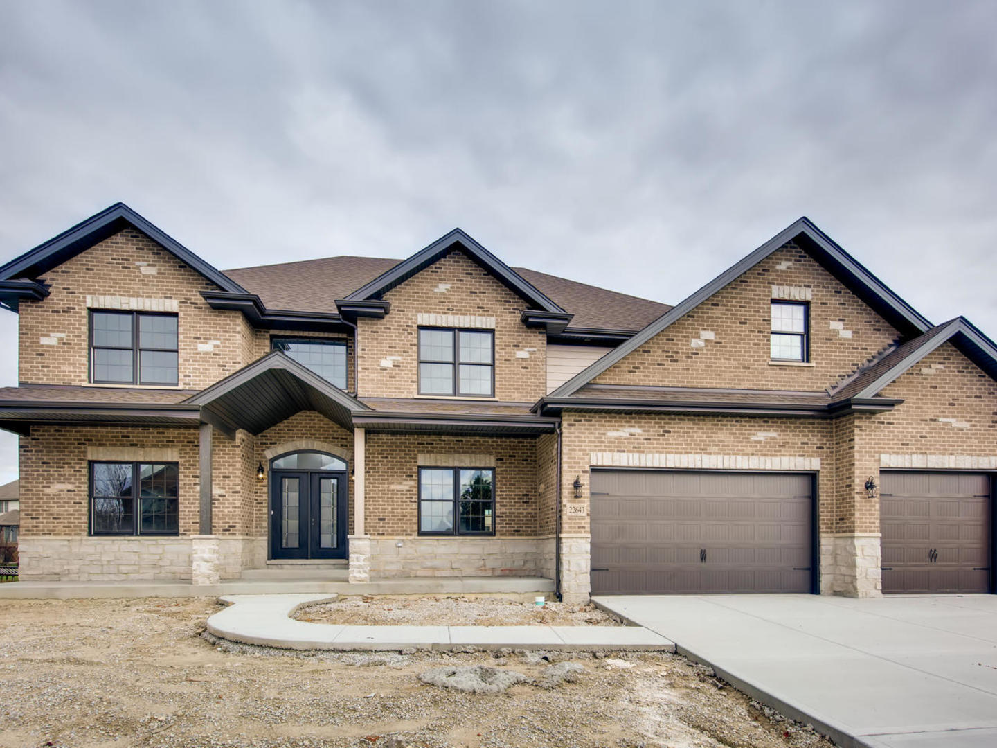 24760 South Hickory Court Crete, IL 60417 - Photo 1 of 15 a front view of a house with a yard and garage
