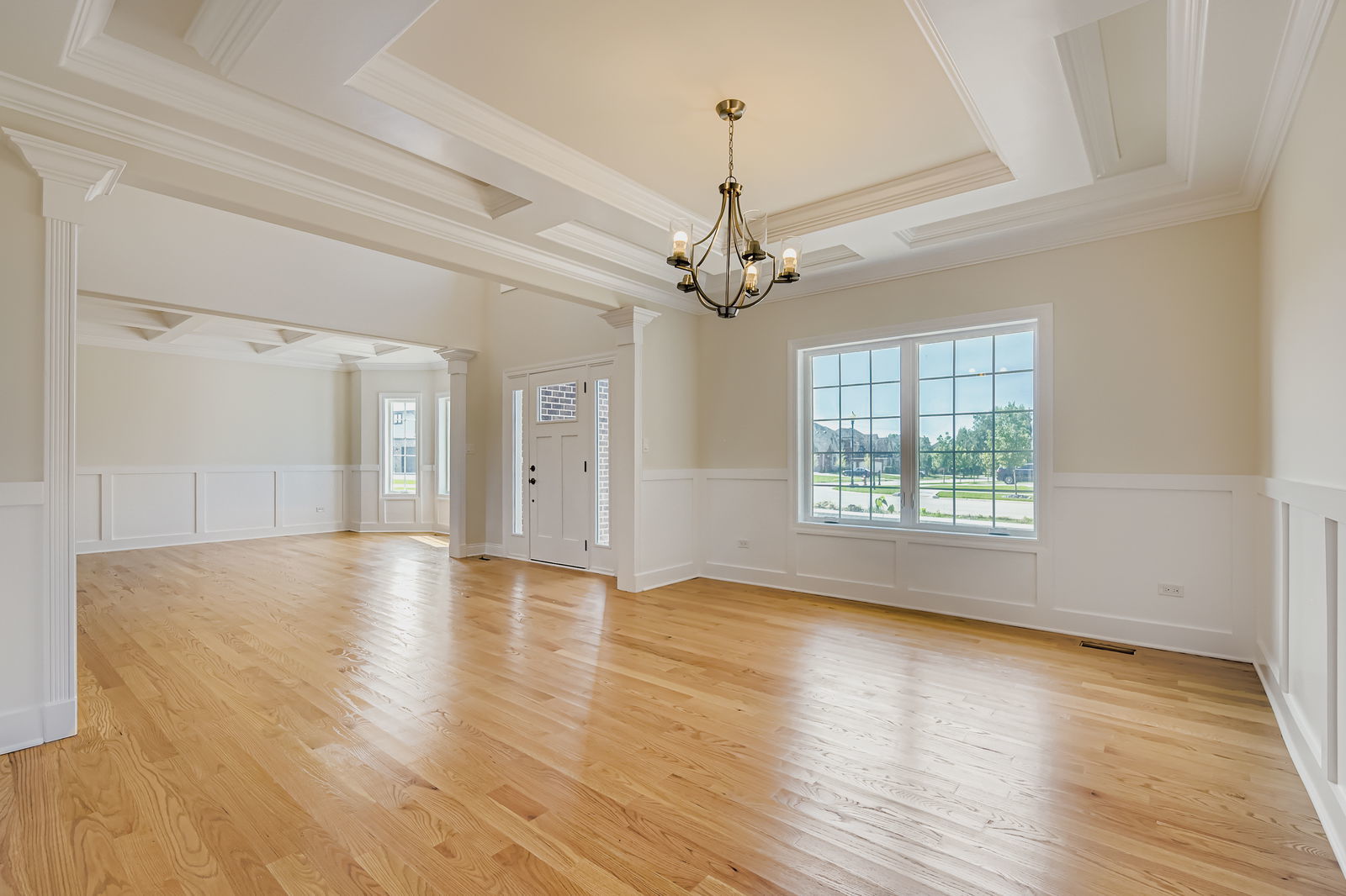 24760 South Hickory Court Crete, IL 60417 - Photo 4 of 15 a view of a livingroom with wooden floor a ceiling fan and windows