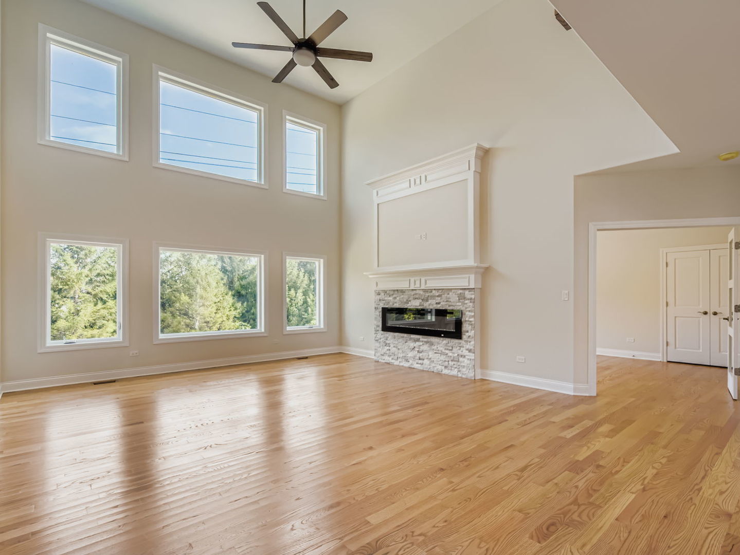 24760 South Hickory Court Crete, IL 60417 - Photo 6 of 15 a view of empty room with wooden floor and fan