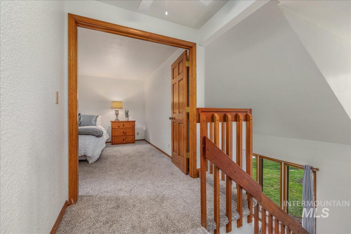 236 East Bayview Court Boise, ID 83706 - Photo 36 of 49 Corridor featuring light carpet and baseboards