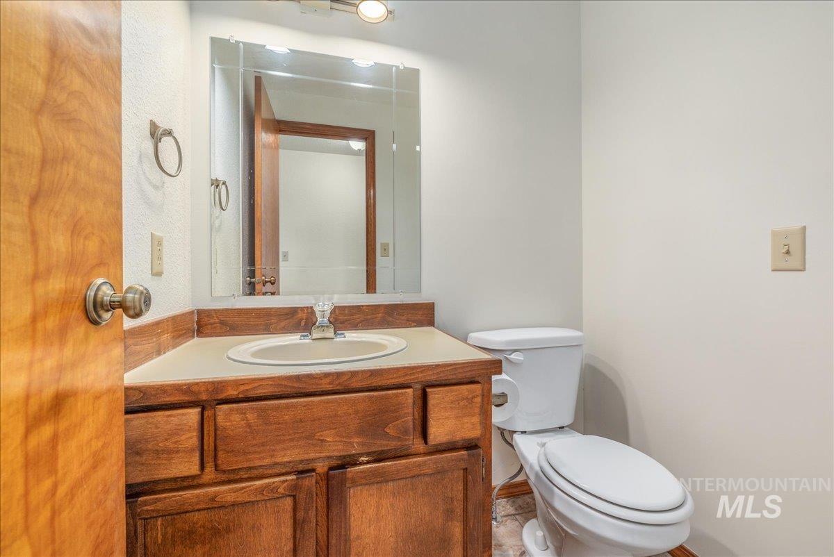 236 East Bayview Court Boise, ID 83706 - Photo 38 of 49 Half bathroom with vanity and toilet